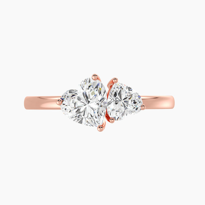 18K Rose Gold Toi et Moi Double Heart Diamond Engagement Ring featuring a 1.00ct and 0.50ct heart-cut lab-grown diamond in a romantic prong setting, crafted in warm rose gold