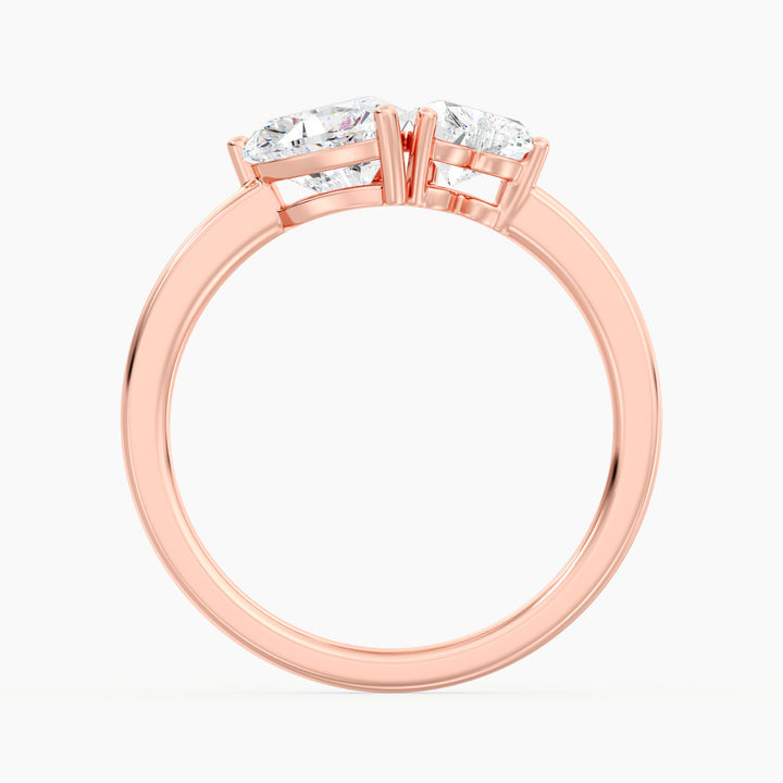 18K Rose Gold Toi et Moi Double Heart Diamond Engagement Ring featuring a 1.00ct and 0.50ct heart-cut lab-grown diamond in a romantic prong setting, crafted in warm rose gold