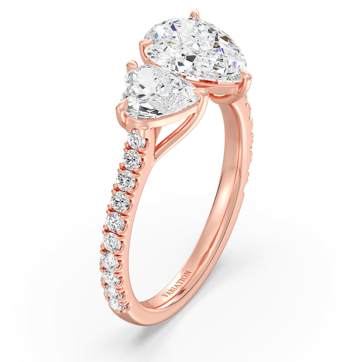 18K Rose Gold Toi et Moi Engagement Ring featuring a 1.50ct Pear-Cut and 1.00ct Heart-Shaped Lab-Grown Diamond, set in a classic prong setting with a pavé diamond band. A timeless and elegant symbol of love in warm rose gold