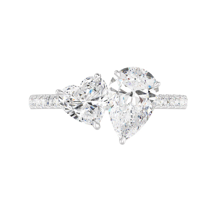18K White Gold Toi et Moi Engagement Ring showcasing a 1.50ct Pear-Cut and 1.00ct Heart-Shaped Lab-Grown Diamond, enhanced by a pavé band with 20 round-cut diamonds (0.36ct total). A sophisticated two-stone ring in luminous white gold