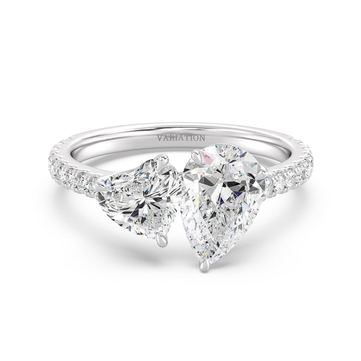 18K White Gold Toi et Moi Engagement Ring showcasing a 1.50ct Pear-Cut and 1.00ct Heart-Shaped Lab-Grown Diamond, enhanced by a pavé band with 20 round-cut diamonds (0.36ct total). A sophisticated two-stone ring in luminous white gold