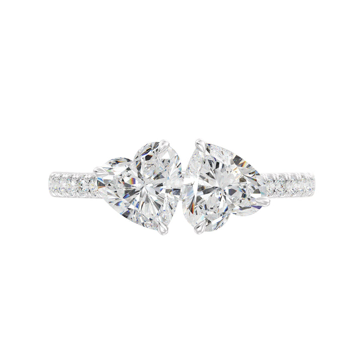 18K White Gold Toi et Moi Heart-Cut Diamond Engagement Ring showcasing two 1.0ct EF/VS heart-cut lab-grown diamonds in a prong setting. The pavé band, set with 20 round-cut lab-grown diamonds (0.36ct total), enhances the brilliance of this sophisticated two-stone ring