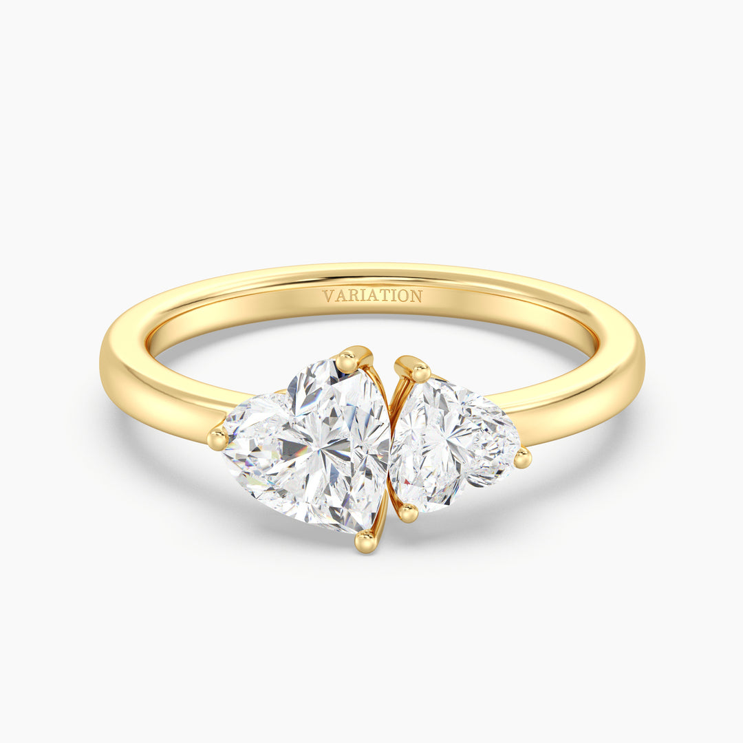 18K Yellow Gold Toi et Moi Double Heart Diamond Engagement Ring with a 1.00ct and 0.50ct heart-cut lab-grown diamond in a classic prong setting, symbolizing love and unity