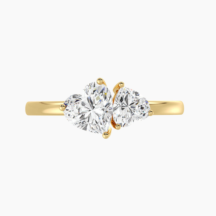 18K Yellow Gold Toi et Moi Double Heart Diamond Engagement Ring with a 1.00ct and 0.50ct heart-cut lab-grown diamond in a classic prong setting, symbolizing love and unity