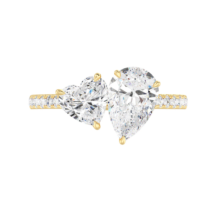 18K Yellow Gold Toi et Moi Engagement Ring with a 1.50ct Pear-Cut and 1.00ct Heart-Shaped Lab-Grown Diamond, accented by a pavé band with 20 round-cut diamonds (0.36ct total). A romantic two-stone design symbolizing love and unity
