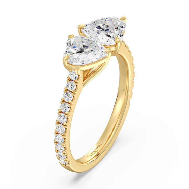 18K Yellow Gold Toi et Moi Heart-Cut Diamond Engagement Ring featuring two 1.0ct EF/VS heart-cut lab-grown diamonds in a classic prong setting with a pavé band adorned with 20 round-cut lab-grown diamonds (0.36ct total). A timeless and romantic two-stone ring