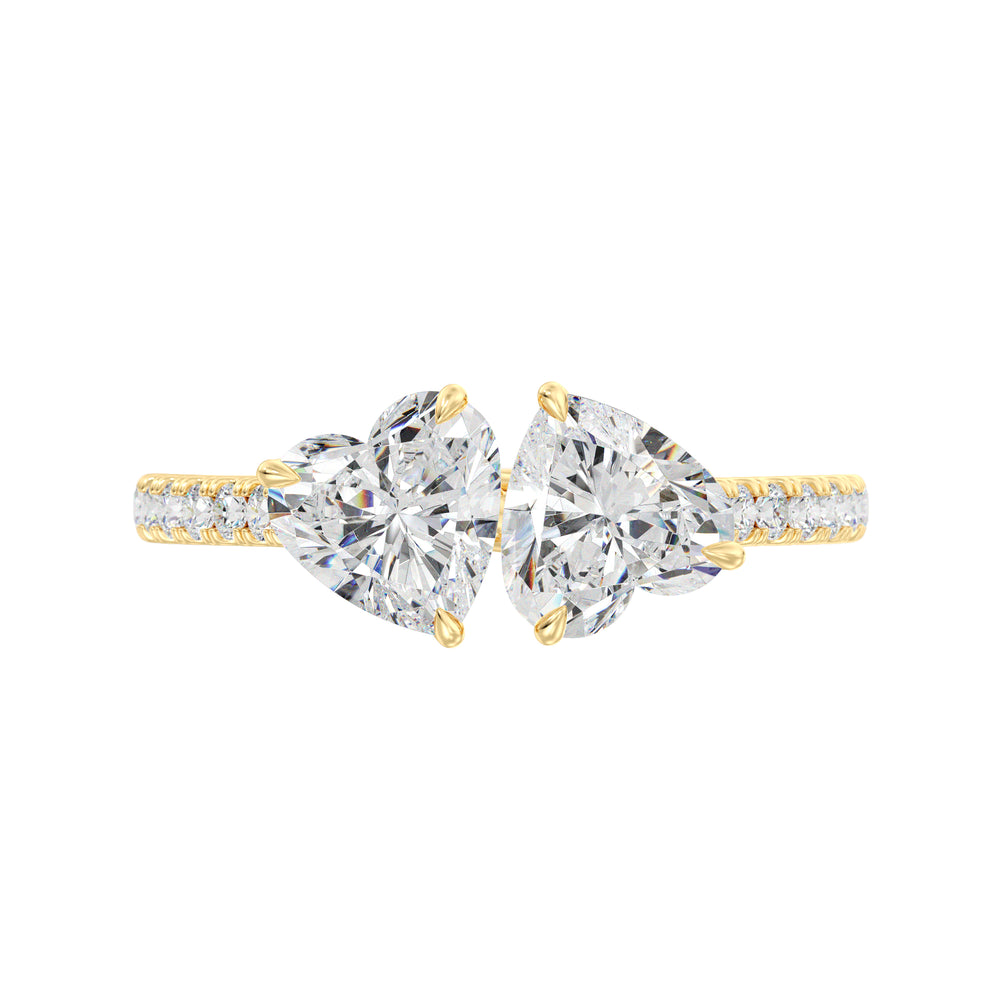 18K Yellow Gold Toi et Moi Heart-Cut Diamond Engagement Ring featuring two 1.0ct EF/VS heart-cut lab-grown diamonds in a classic prong setting with a pavé band adorned with 20 round-cut lab-grown diamonds (0.36ct total). A timeless and romantic two-stone ring