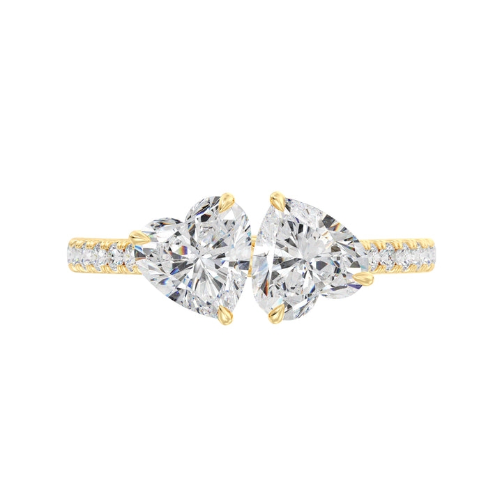 18K Yellow Gold Toi et Moi Heart-Cut Diamond Engagement Ring featuring two 1.0ct EF/VS heart-cut lab-grown diamonds in a classic prong setting with a pavé band adorned with 20 round-cut lab-grown diamonds (0.36ct total). A timeless and romantic two-stone ring