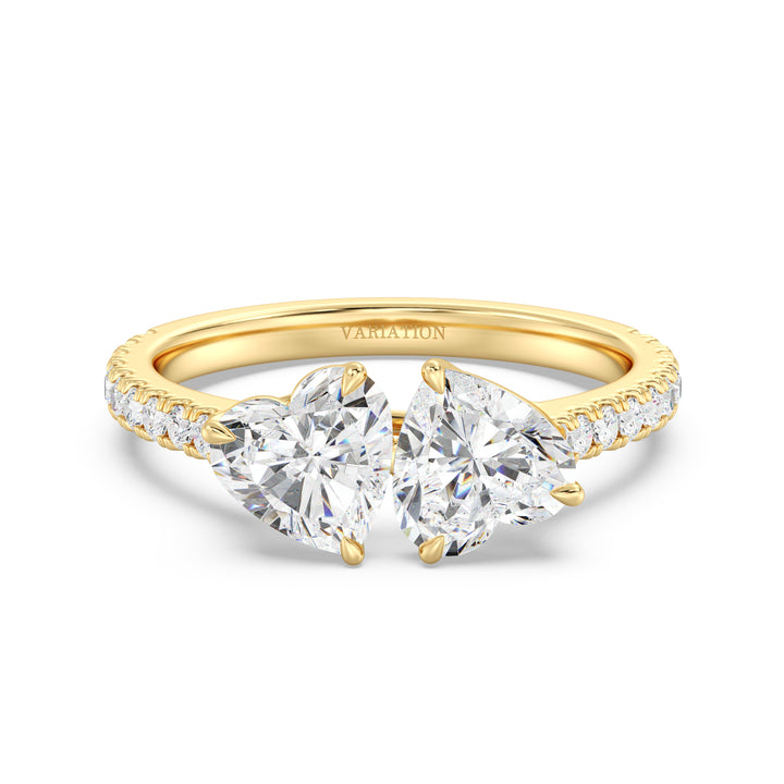 18K Yellow Gold Toi et Moi Heart-Cut Diamond Engagement Ring featuring two 1.0ct EF/VS heart-cut lab-grown diamonds in a classic prong setting with a pavé band adorned with 20 round-cut lab-grown diamonds (0.36ct total). A timeless and romantic two-stone ring