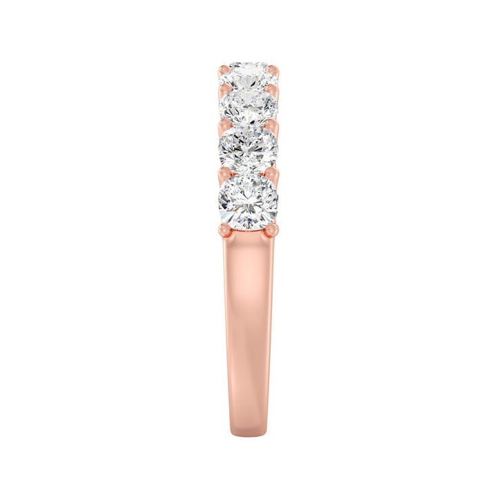 Image of a 9-stone cushion-cut lab-grown diamond scallop half-eternity wedding ring in 18K rose gold, featuring nine secure, low-profile prong-set diamonds