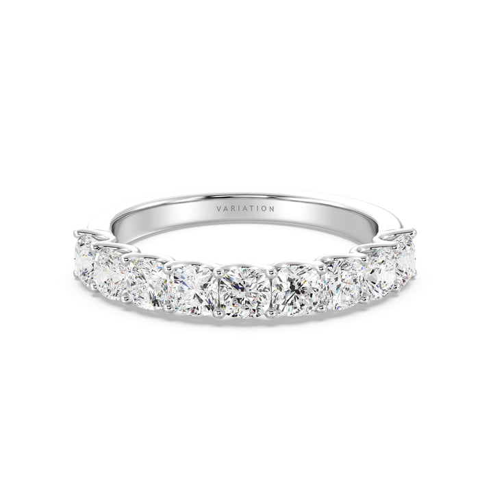 Image of a 9-stone cushion-cut lab-grown diamond scallop half-eternity wedding ring in 18K white gold, featuring nine cushion-cut diamonds set in a sleek, low-profile shared prong setting