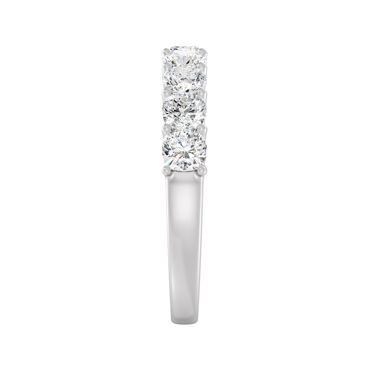 Image of a 9-stone cushion-cut lab-grown diamond scallop half-eternity wedding ring in 18K white gold, featuring nine cushion-cut diamonds set in a sleek, low-profile shared prong setting
