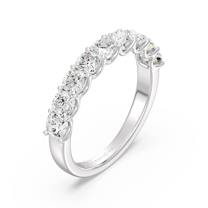 Image of a 9-stone cushion-cut lab-grown diamond scallop half-eternity wedding ring in 18K white gold, featuring nine cushion-cut diamonds set in a sleek, low-profile shared prong setting