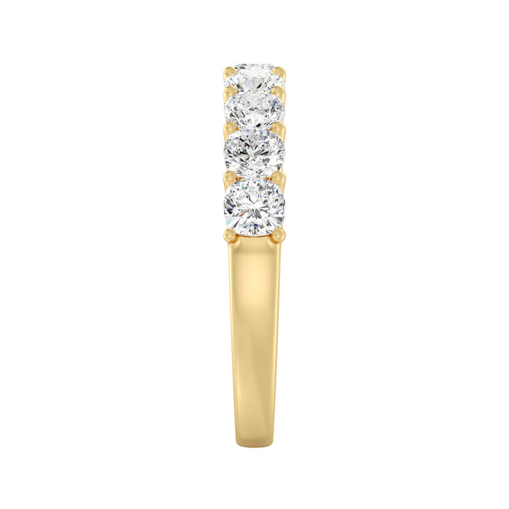 Image of a 9-stone cushion-cut lab-grown diamond scallop half-eternity wedding ring in 18K yellow gold, showcasing nine cushion-cut diamonds set in a secure, low-profile prong setting
