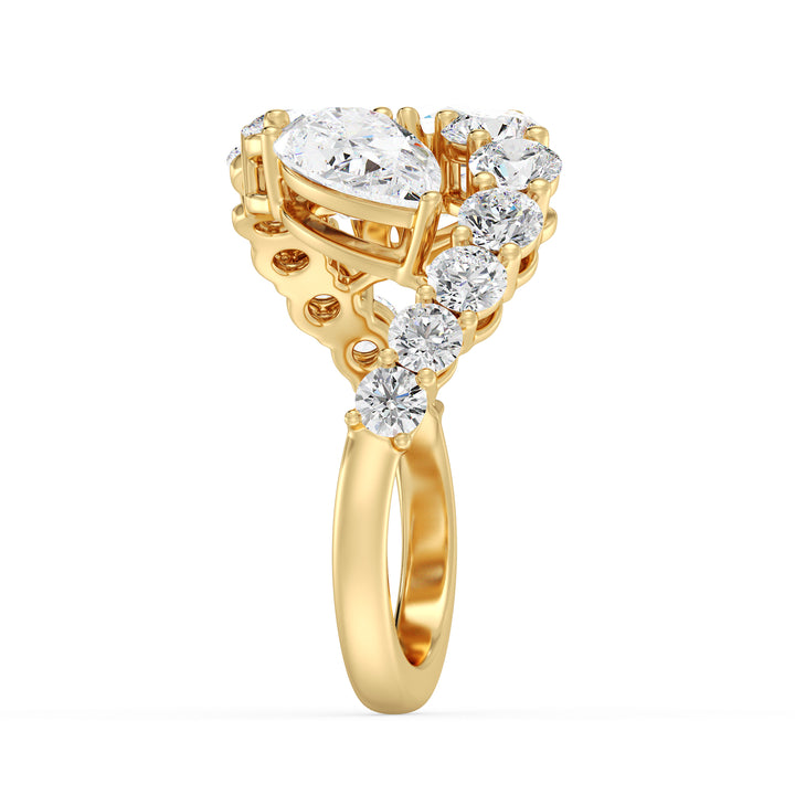 A breathtaking 18K yellow gold Toi et Moi bypass ring featuring two pear-cut lab-grown diamonds (1.50ct each) set in a classic prong setting. The ring is adorned with 12 round lab-grown diamonds (1.60ct total), enhancing its 4.60ct total carat weight. The warm yellow gold band beautifully complements the brilliance of the EF color, VS clarity diamonds, making it a timeless choice for engagements, anniversaries, or special occasions
