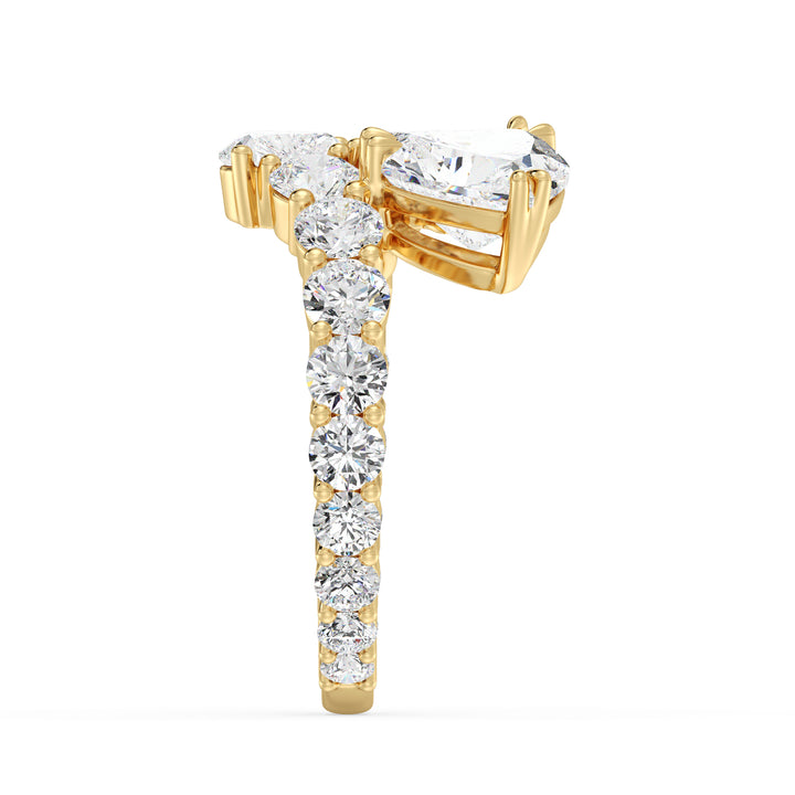 A romantic Three-Stone 'Toi et Moi' Heart-Shaped Lab-Grown Diamond Cluster Ring in 18K Rose Gold, adorned with two 0.50ct EF/VS heart-cut lab-grown diamonds, a 1.00ct EF/VS heart-cut lab-grown diamond, and 18 round lab-grown diamonds with a total weight of 4.17ct. The soft blush hue of rose gold adds a contemporary and feminine charm to this classic setting.