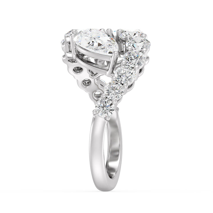 An elegant 18K white gold Toi et Moi bypass ring featuring two pear-cut lab-grown diamonds (1.50ct each) set in a timeless prong setting. The sleek white gold band enhances the brilliance of the EF color, VS clarity diamonds, complemented by 12 round lab-grown diamonds (1.60ct total), creating a dazzling 4.60ct total carat weight piece. A sophisticated and classic choice for engagements, anniversaries, or a luxurious statement ring