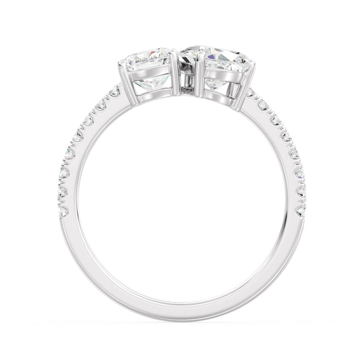 An elegant Pear & Cushion Two-Stone Lab-Grown Diamond 'Toi et Moi' Ring in 18K White Gold. Designed with a 1.00ct Pear-cut diamond and 1.00ct Cushion-cut diamond, set side by side in a classic prong setting. The sleek white gold band, adorned with 16 Round-Cut Lab-Grown Diamonds (0.24ct total), enhances the ring’s brilliance and sophistication.