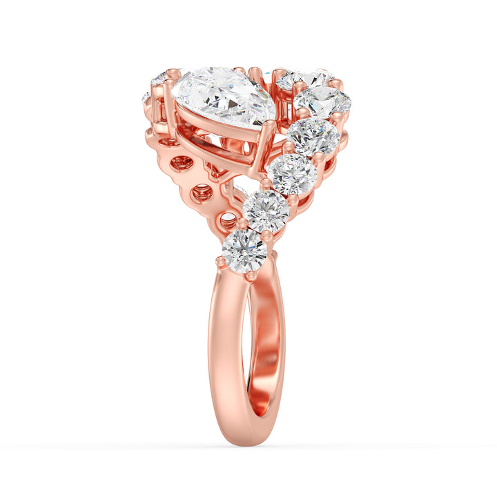 A romantic 18K rose gold Toi et Moi bypass ring showcasing two pear-cut lab-grown diamonds (1.50ct each) in a classic prong setting. The soft pink hue of the rose gold band enhances the sparkle of the 12 round lab-grown diamonds (1.60ct total), creating a stunning 4.60ct total carat weight design. This elegant and modern ring symbolizes love and connection, perfect for engagements, anniversaries, or a heartfelt gift