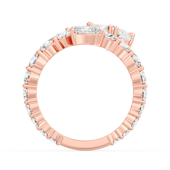 A romantic Three-Stone 'Toi et Moi' Heart-Shaped Lab-Grown Diamond Cluster Ring in 18K Rose Gold, adorned with two 0.50ct EF/VS heart-cut lab-grown diamonds, a 1.00ct EF/VS heart-cut lab-grown diamond, and 18 round lab-grown diamonds with a total weight of 4.17ct. The soft blush hue of rose gold adds a contemporary and feminine charm to this classic setting.