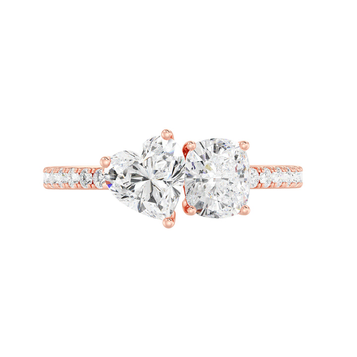 Elegant Heart & Cushion Two-Stone Lab-Grown Diamond 'Toi et Moi' Ring in 18K Rose Gold. Showcasing a 1.00ct heart-cut and a 1.00ct cushion-cut EF/VS lab-grown diamond, with 16 round-cut diamonds (0.24ct) adorning the warm rose gold band