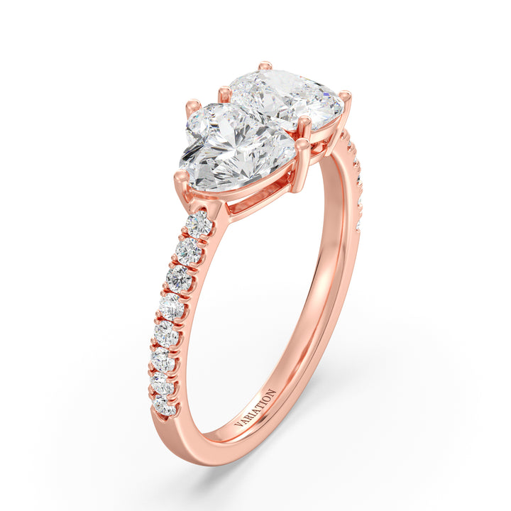 Elegant Heart & Cushion Two-Stone Lab-Grown Diamond 'Toi et Moi' Ring in 18K Rose Gold. Showcasing a 1.00ct heart-cut and a 1.00ct cushion-cut EF/VS lab-grown diamond, with 16 round-cut diamonds (0.24ct) adorning the warm rose gold band