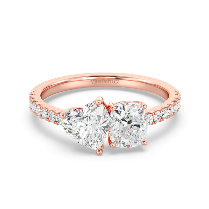 Elegant Heart & Cushion Two-Stone Lab-Grown Diamond 'Toi et Moi' Ring in 18K Rose Gold. Showcasing a 1.00ct heart-cut and a 1.00ct cushion-cut EF/VS lab-grown diamond, with 16 round-cut diamonds (0.24ct) adorning the warm rose gold band
