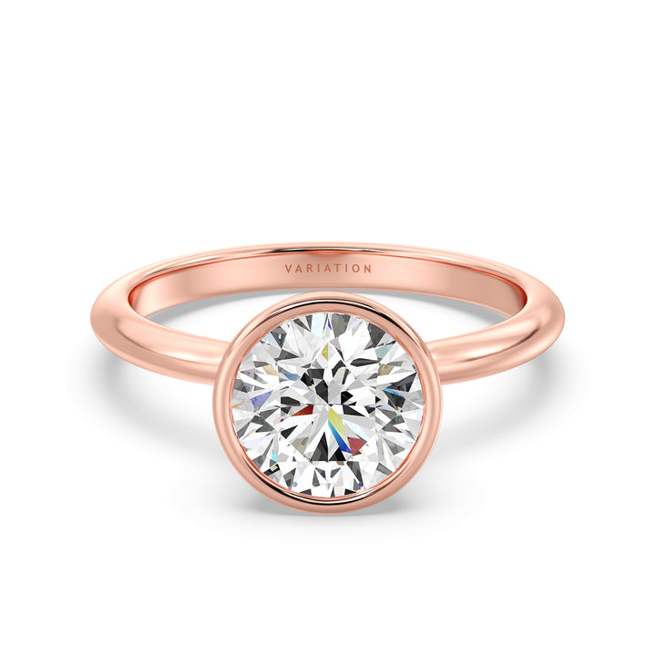 Elegant Round Cut Bezel Set Lab-Grown Diamond Solitaire Ring in 18K Rose Gold. Features a brilliant round cut diamond with a secure bezel setting