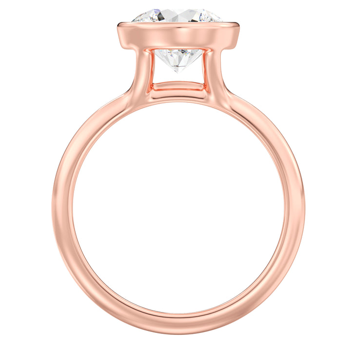 Elegant Round Cut Bezel Set Lab-Grown Diamond Solitaire Ring in 18K Rose Gold. Features a brilliant round cut diamond with a secure bezel setting