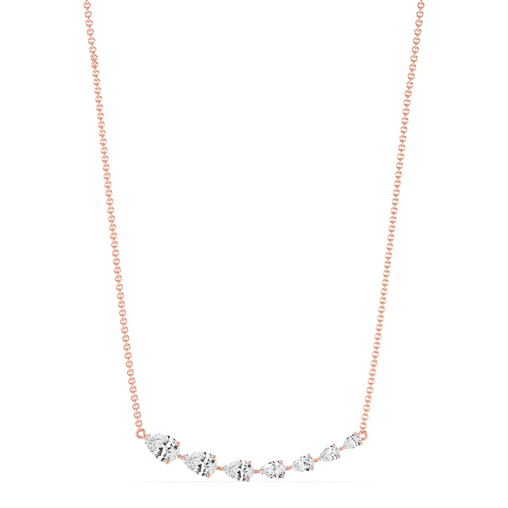 Graduated pear-cut lab-grown diamond necklace in 18K rose gold featuring 7 EF/VS diamonds totaling 3.07 carats in a prong setting and asymmetric curved silhouette