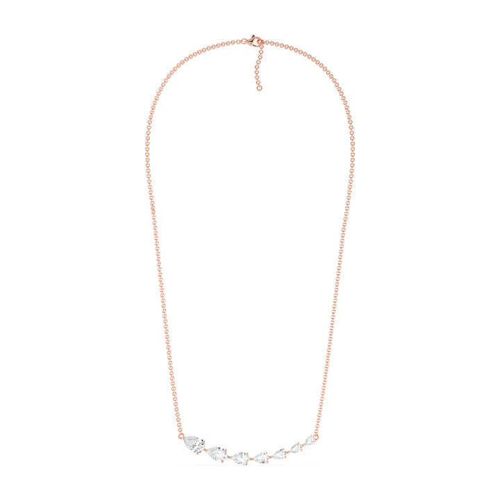 Graduated pear-cut lab-grown diamond necklace in 18K rose gold featuring 7 EF/VS diamonds totaling 3.07 carats in a prong setting and asymmetric curved silhouette