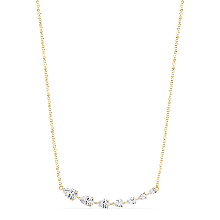 Graduated pear-cut lab-grown diamond necklace in 18K yellow gold with 7 EF/VS diamonds totaling 3.07 carats in a prong setting and asymmetric smile design