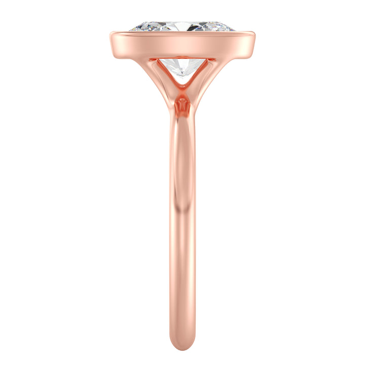 Oval-cut lab-grown diamond solitaire ring set in 18K rose gold, featuring a sleek bezel setting that enhances the brilliance of the EF/VS diamond