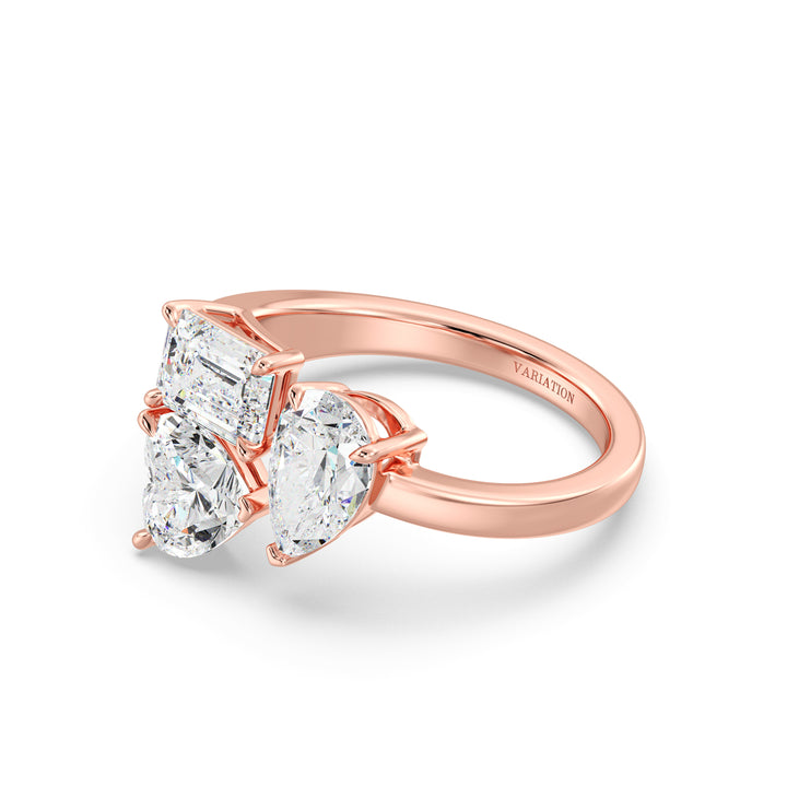Three-Stone Toi et Moi Lab-Grown Diamond Ring in 18K Rose Gold, showcasing a 1.00ct Heart, 1.00ct Pear, and 1.00ct Emerald-cut EF/VS clarity diamonds in a classic prong setting. The romantic rose gold band beautifully contrasts with the diamonds, offering a modern yet vintage-inspired aesthetic