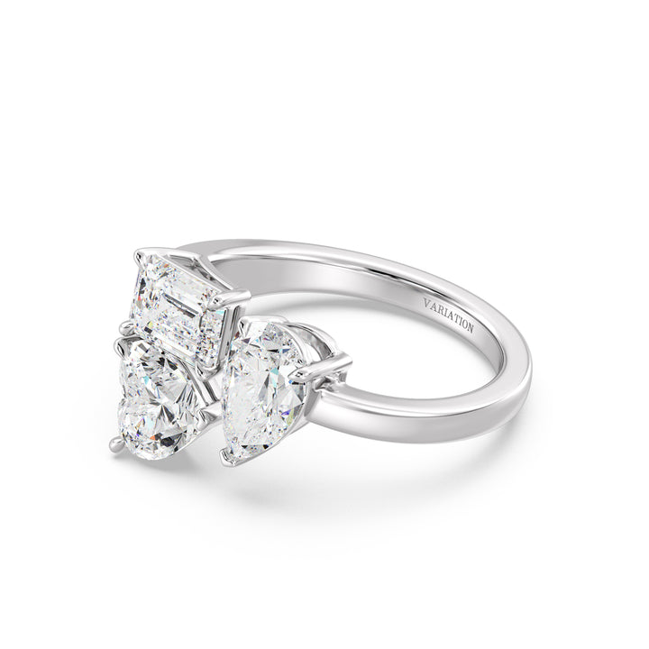 Three-Stone Toi et Moi Lab-Grown Diamond Ring in 18K White Gold, featuring a 1.00ct Heart, 1.00ct Pear, and 1.00ct Emerald-cut EF/VS clarity diamonds in a classic prong setting. The sleek white gold band enhances the diamonds' brilliance, delivering a sophisticated and contemporary appeal.