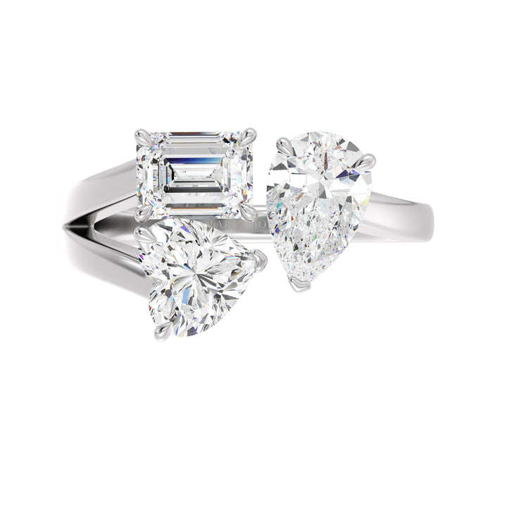 Three-Stone Toi et Moi Lab-Grown Diamond Ring in 18K White Gold, featuring a 1.00ct Heart, 1.00ct Pear, and 1.00ct Emerald-cut EF/VS clarity diamonds in a classic prong setting. The sleek white gold band enhances the diamonds' brilliance, delivering a sophisticated and contemporary appeal.