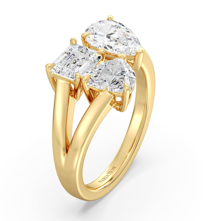 Three-Stone Toi et Moi Lab-Grown Diamond Ring in 18K Yellow Gold, featuring a 1.00ct Heart, 1.00ct Pear, and 1.00ct Emerald-cut EF/VS clarity diamonds in a classic prong setting. The warm yellow gold band enhances the brilliance of the diamonds, creating a timeless and elegant look
