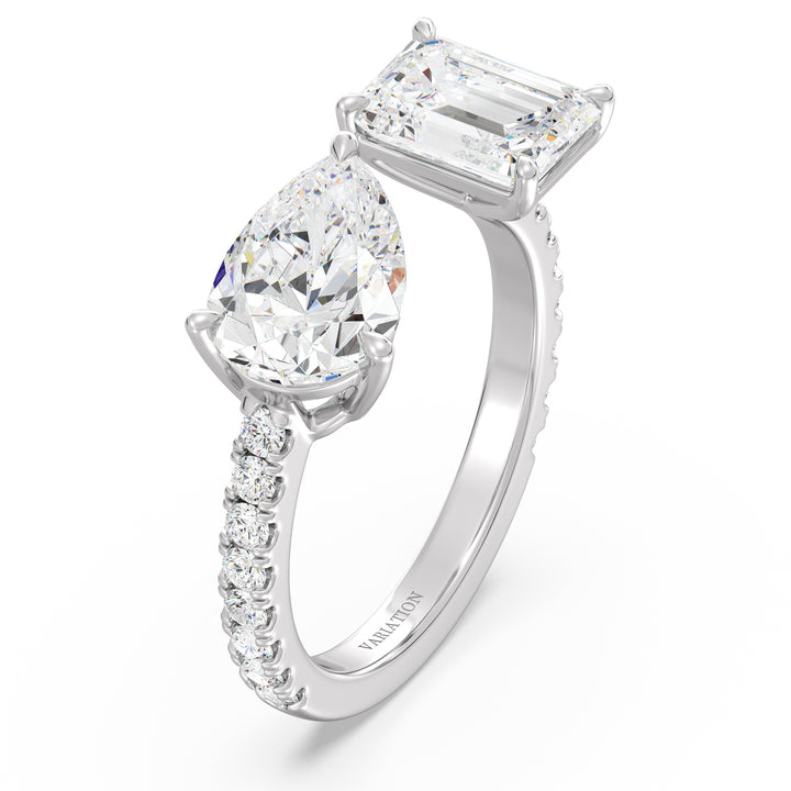 Timeless Two-Stone Toi et Moi Lab-Grown Diamond Ring in 18K White Gold, featuring a 2.00ct EF/VS Pear-Cut and a 2.00ct EF/VS Emerald-Cut diamond in a four-prong setting. The sleek white gold band is accented with 16 round brilliant lab-grown diamonds totaling 0.34ct, offering a sophisticated and radiant appeal