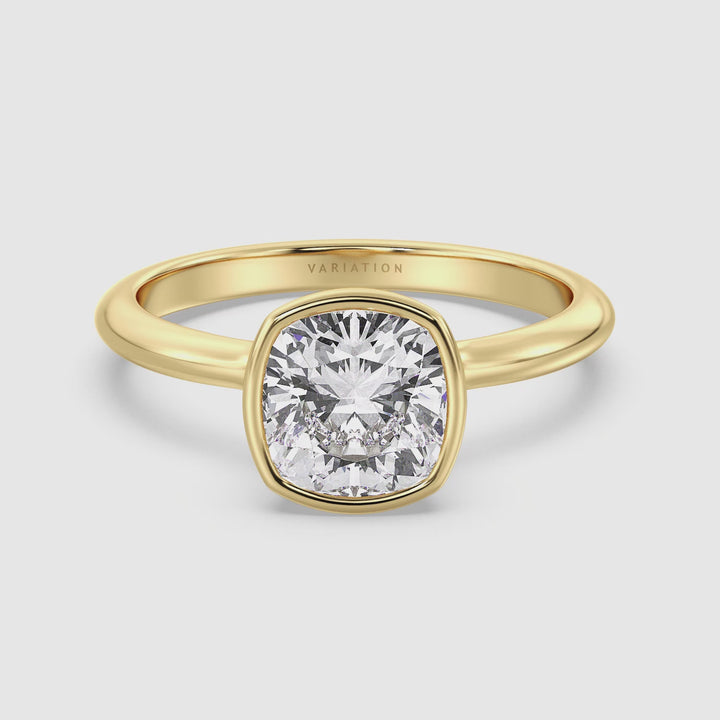 Video showcasing the Elegant Square Cushion Cut Bezel-Set Lab Grown Diamond Solitaire Ring in yellow gold. The video highlights the ring’s sleek bezel setting, which securely cradles a square cushion cut diamond. Viewers can see the ring from various angles and appreciate its design and craftsmanship. Available in carat weights of 1.00ct, 2.00ct, 3.00ct, and 4.00ct