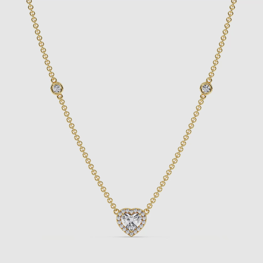 Video showcasing the Elegant Heart Diamond Bezel Station Necklace in 18K Yellow Gold
