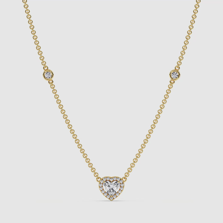 Video showcasing the Elegant Heart Diamond Bezel Station Necklace in 18K Yellow Gold