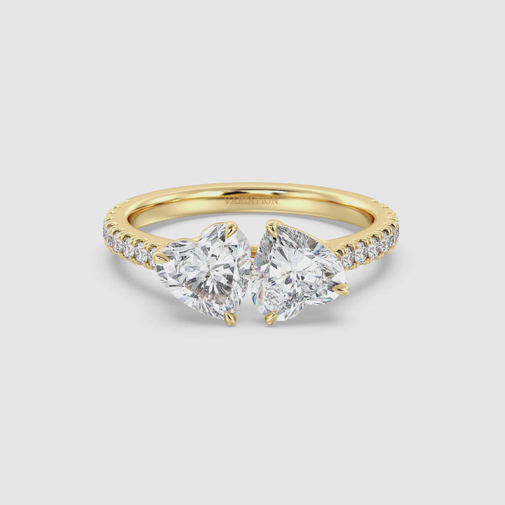 A breathtaking 18K Yellow Gold Toi et Moi Heart-Cut Diamond Engagement Ring featuring two sparkling 1.0ct EF/VS heart-cut lab-grown diamonds in a classic prong setting. The elegant pavé band, adorned with 20 round-cut lab-grown diamonds (0.36ct total), enhances its brilliance. The warm yellow gold setting adds a timeless charm, making this custom-made two-stone ring perfect for engagements, anniversaries, or as a meaningful promise ring. ✨💛 #ToiEtMoi #YellowGold #LabGrownDiamonds