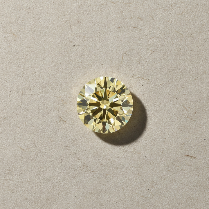 1.29 Carat Round Fancy Yellow Lab Grown Diamond VS2 IGI Certified