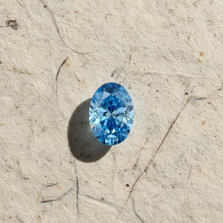 1,03 karaat ovale geslepen laboratoriumdiamant, VS1/fancy levendig blauw