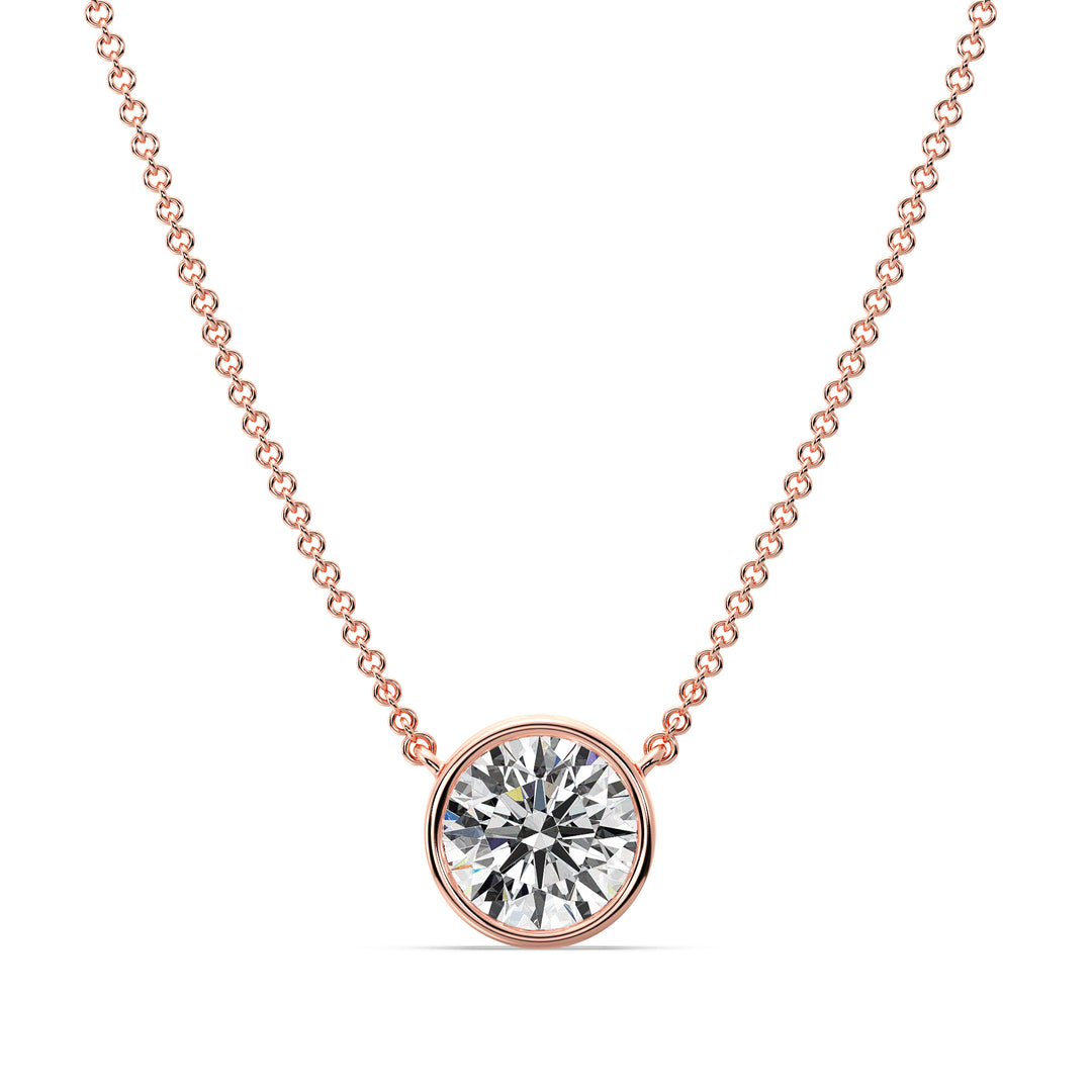 2 Carat Bezel-Set Round Lab-Grown Diamond Solitaire Pendant Necklace in 18K Rose Gold. IGI-certified E/VS diamond set in a modern bezel setting with a delicate rose gold chain, exuding warmth and elegance