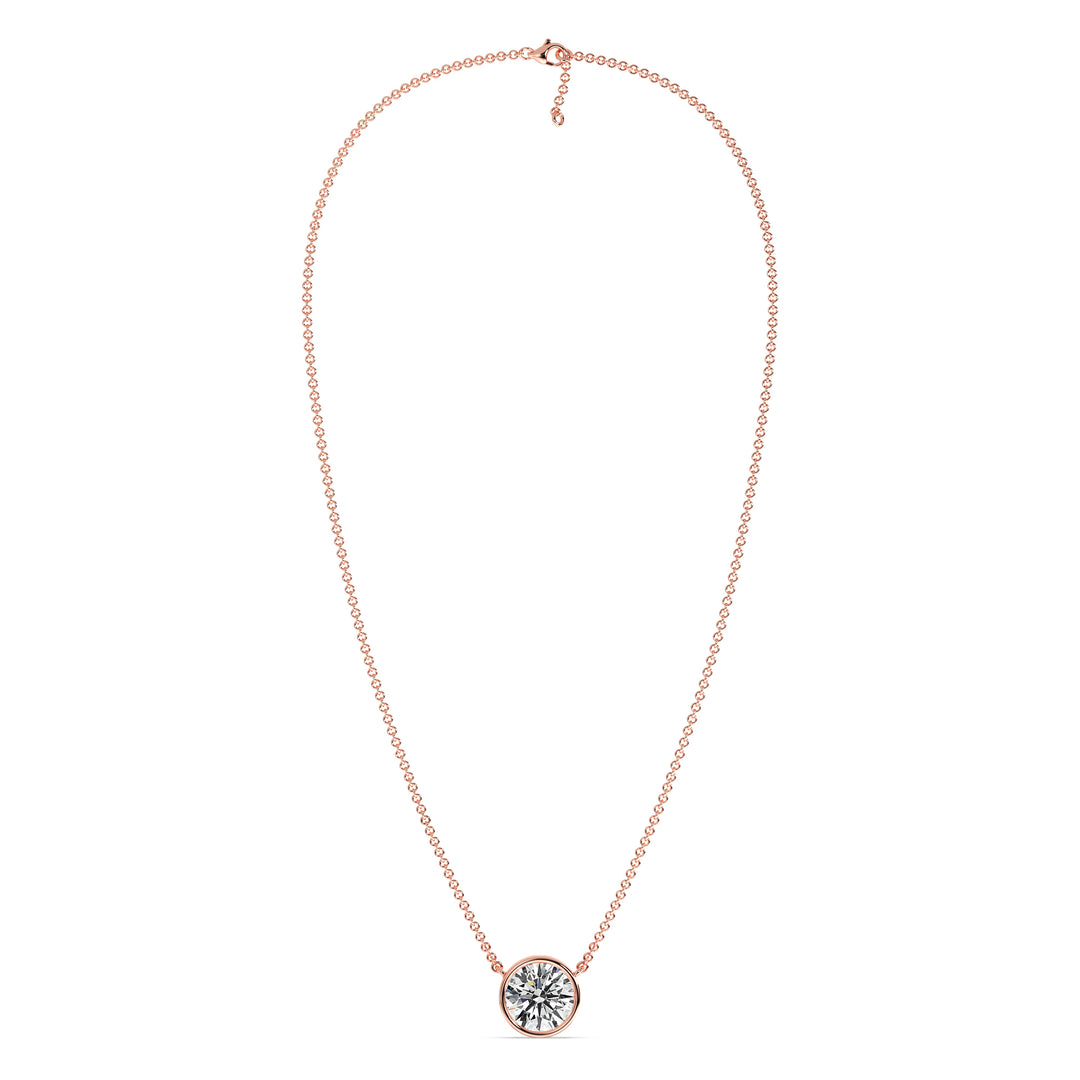 2 Carat Bezel-Set Round Lab-Grown Diamond Solitaire Pendant Necklace in 18K Rose Gold. IGI-certified E/VS diamond set in a modern bezel setting with a delicate rose gold chain, exuding warmth and elegance