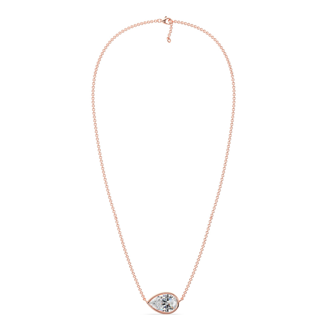 Close-up image of a 2 Carat Lab-Grown Pear-Cut Diamond Bezel-Set Solitaire Pendant Necklace in 18K Rose Gold, featuring a shimmering E/VS pear-cut diamond on a delicate rose gold chain