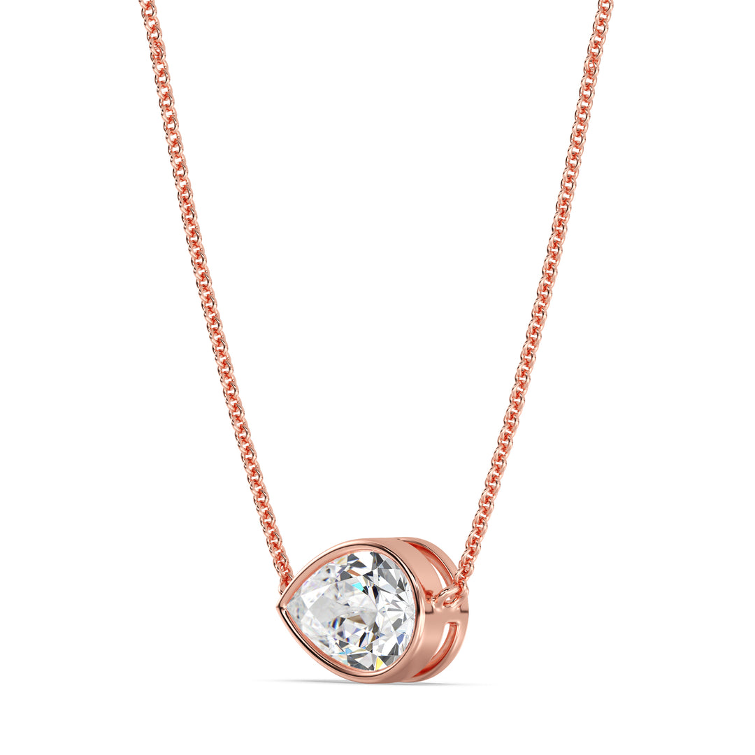 Close-up image of a 2 Carat Lab-Grown Pear-Cut Diamond Bezel-Set Solitaire Pendant Necklace in 18K Rose Gold, featuring a shimmering E/VS pear-cut diamond on a delicate rose gold chain