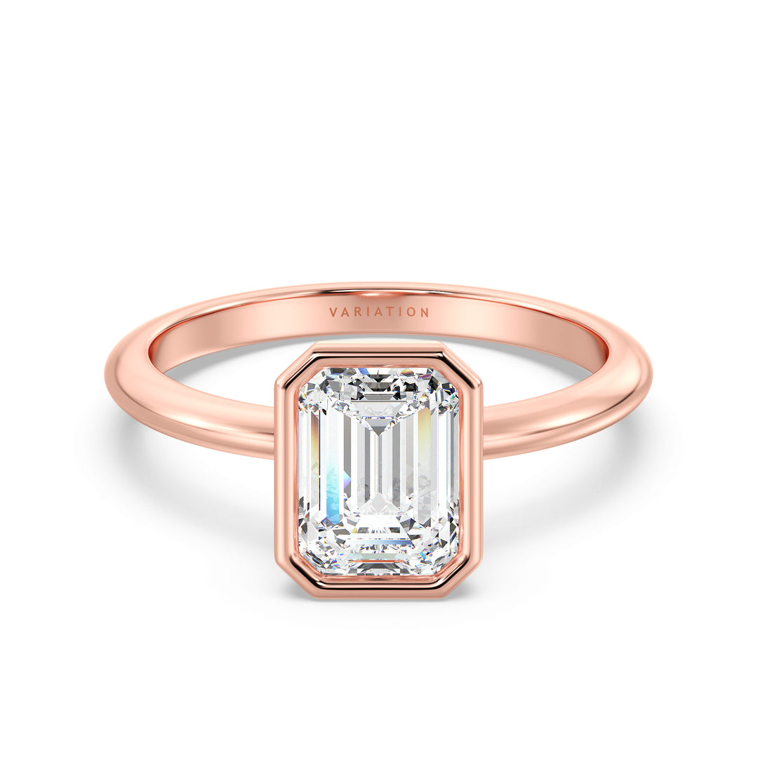 Emerald Cut Lab-Grown Diamond Bezel-Set Solitaire Ring in 18K Rose Gold. The ring showcases a stunning emerald cut diamond cradled in a sleek bezel setting, highlighting the romantic blush of rose gold