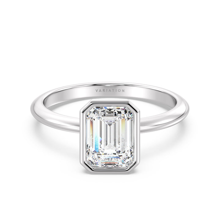 Emerald Cut Lab-Grown Diamond Bezel-Set Solitaire Ring in 18K White Gold. A brilliant emerald cut diamond is elegantly set in a modern bezel setting, complemented by the contemporary allure of white gold